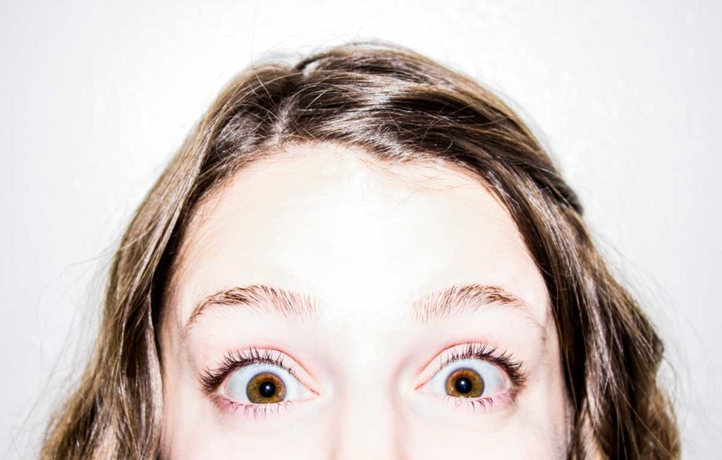 woman with surprise wide eyes